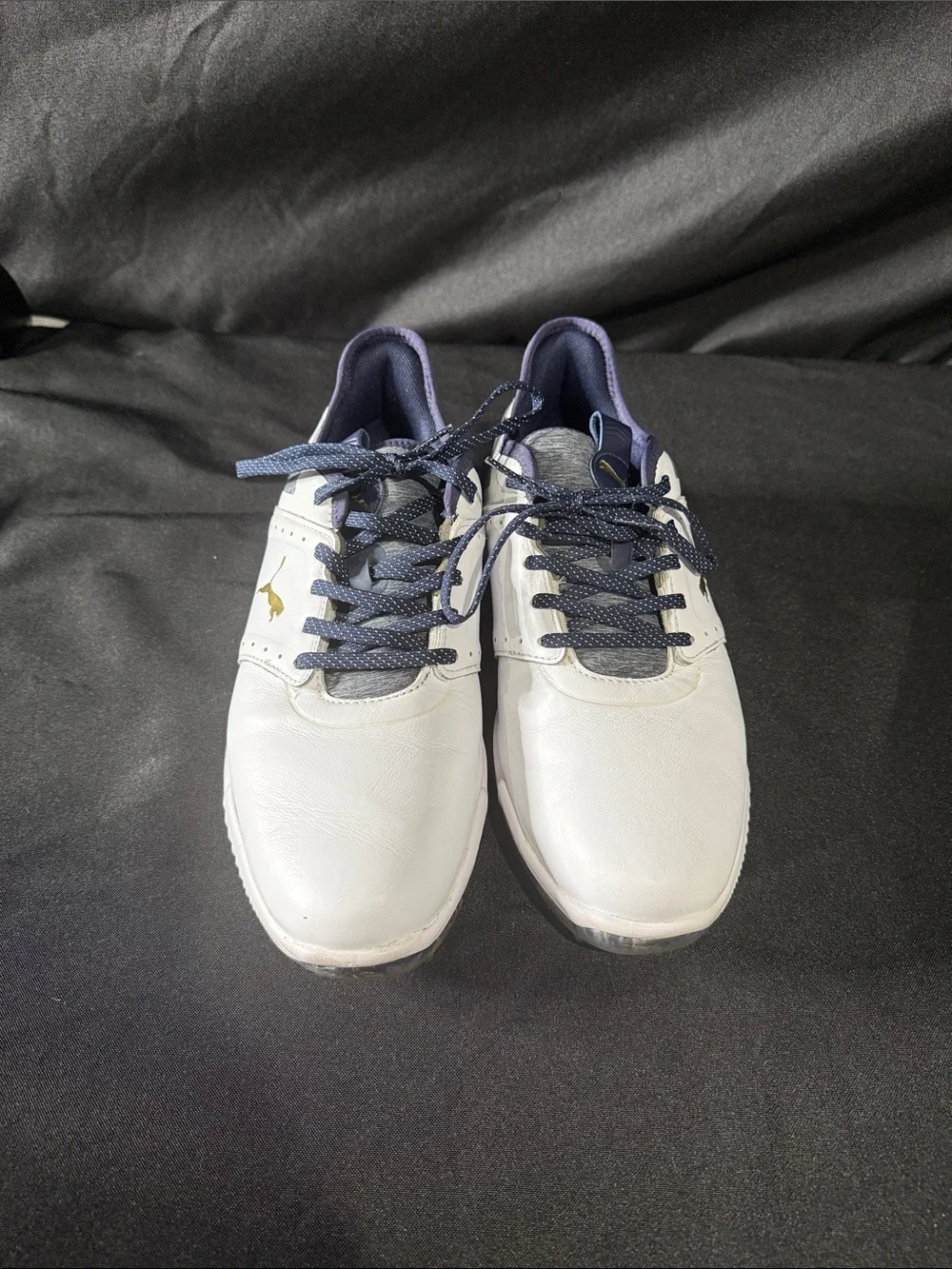 Puma men’s White and Navy Athletic Golf Shoes with Gold Logo